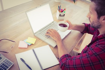 Creative businessman drinking a cup of tea