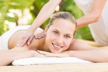 Obraz na płótnie Canvas Attractive woman getting massage on her back