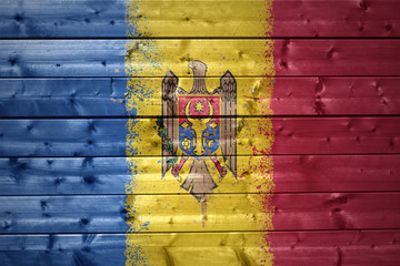 painted moldavian flag on a wooden texture