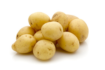 Potatoes on the white background.  New harvest.