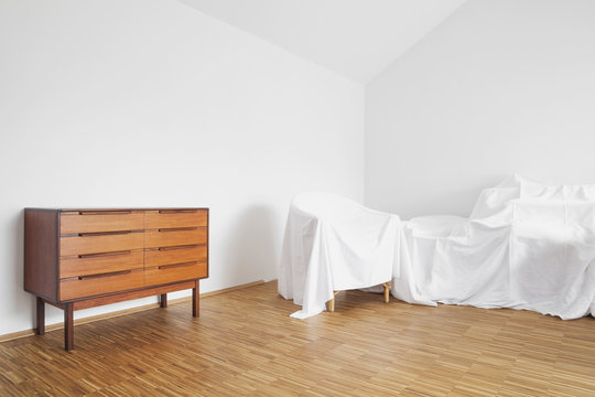 Sideboard and covered furniture in a penthouse