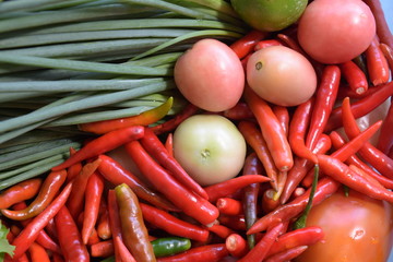 Assortment of vegetables, onion, parsley, red chilli, tomato and lemon