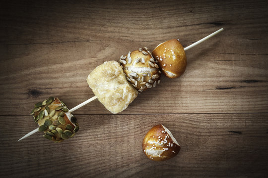 Different mini lye rolls, skewered