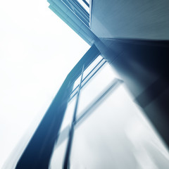 Obraz premium Wide angle abstract background view of steel light blue high rise commercial building 