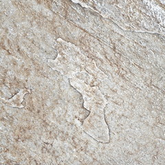 Natural brown stone seamless background and texture