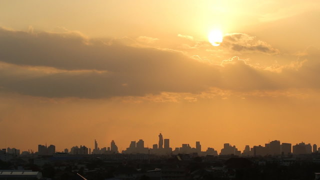 Time lapse ,clouds moving with sunset in city area  Bangkok  of Building Silhouette 
