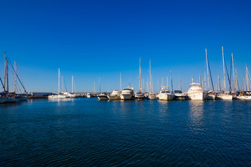 Fototapeta na wymiar Sea bay with yachts. Fishing boats in the harbour
