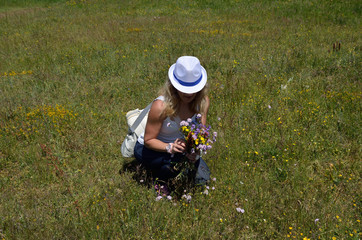 Lady and spring meadow flowers