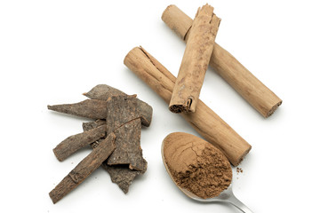 Cinnamon sticks and cinnamon powder isolated on white