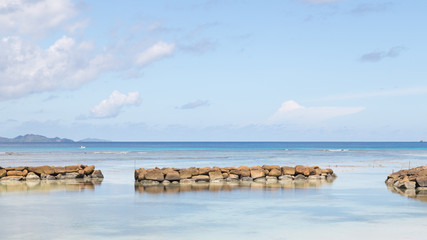 Fototapeta premium seascape with a breakwater in Seychelles