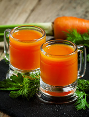 Fresh carrot diet  juice  in old-fashioned glass mug, selective