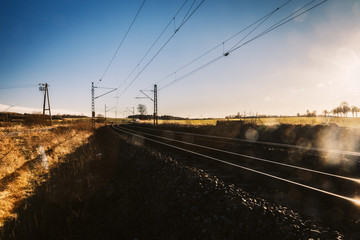 Germany, Burgstemmen, rails and power lines at rural scene
