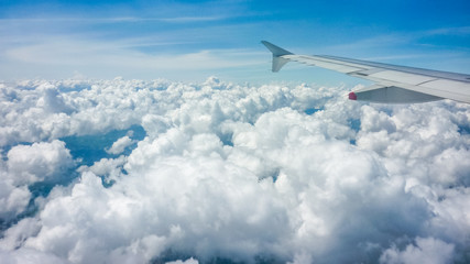 Fototapeta na wymiar Clouds and Sky View from Window Plane