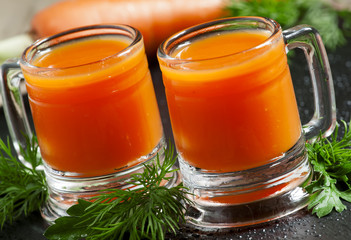 Fresh carrot diet  juice  in old-fashioned glass mug, selective