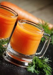 Fresh carrot diet  juice  in old-fashioned glass mug, selective
