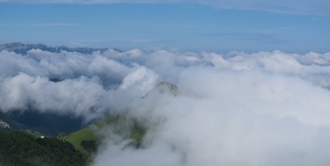 Fototapeta na wymiar Sky and sea of clouds with Mount Ausa Gaztelu in Basque Country