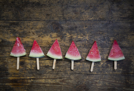 Row of six watermelon popsicles