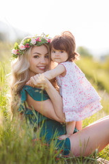 Happy woman with a child resting on the nature