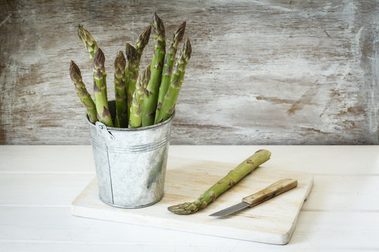 Metal pail with green asparagus