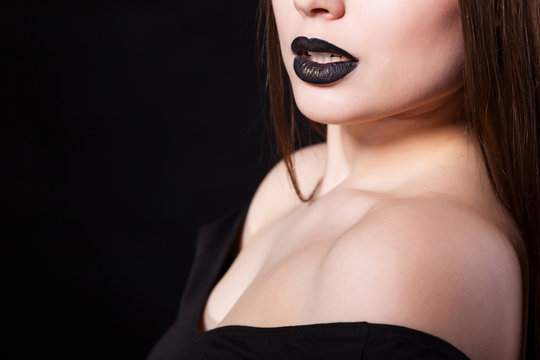 Portrait of beautiful fashion model, woman with black lipstick