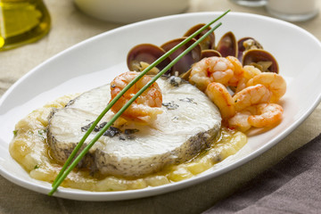 Hake with shrimps and clams