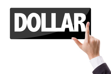 Naklejka premium Businessman pressing button with the text: Dollar
