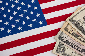 American flag and dollars