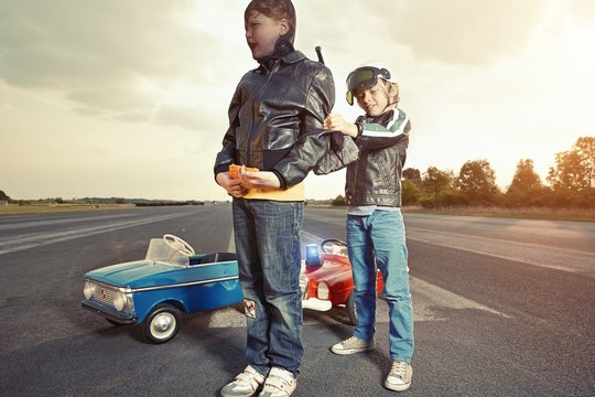 Two boys playing cops and robbers