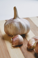 Raw garlic on the cutting board