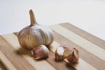 Raw garlic on the cutting board