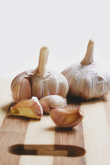 Raw garlic on the cutting board