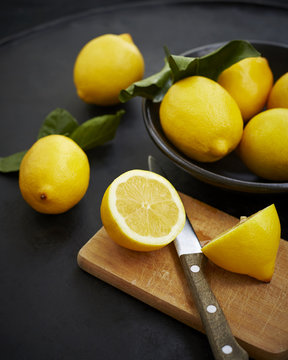 Sliced lemons in chopping board