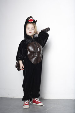 Proud little girl masquerade as a gorilla