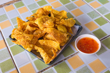 Fried dumplings with red chili sauce