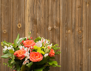 bouquet of flowers on a wooden background.