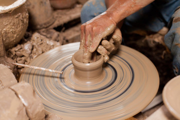 Hands of potter, was produced on range of pot.