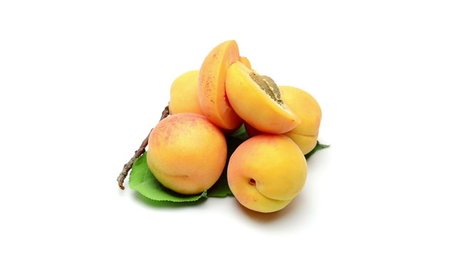 fresh bio apricots rotating on white background