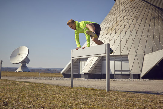 Germany, Raisting, sportive young man at ground station