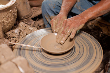 Hands of potter, was produced on range of pot.