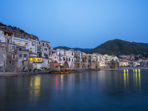 Italy, Sicily, Cefalu, Old buildings at the beach