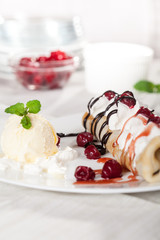 pancake with fruit and vanilla ice cream