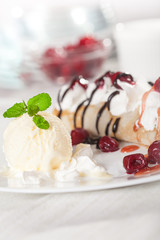 crepes with fruit and vanilla ice cream