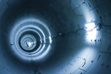 longest tunnel in the underground illuminated with blue light