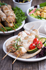Pork kebabs on pita with vegetables