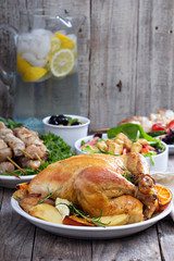 Whole roasted chicken on dinner table
