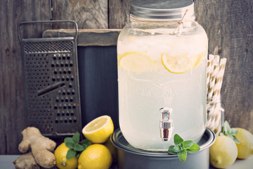 Ginger homemade lemonade in a beverage dispencer