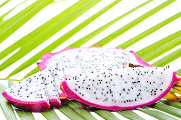 Dragon fruit on palm leaf