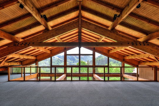 Alpine chalet window looking out into mountains
