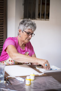 Female painter preparing for painting a picture