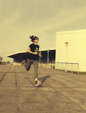 Spain, Gijon, Woman jogging in the city
